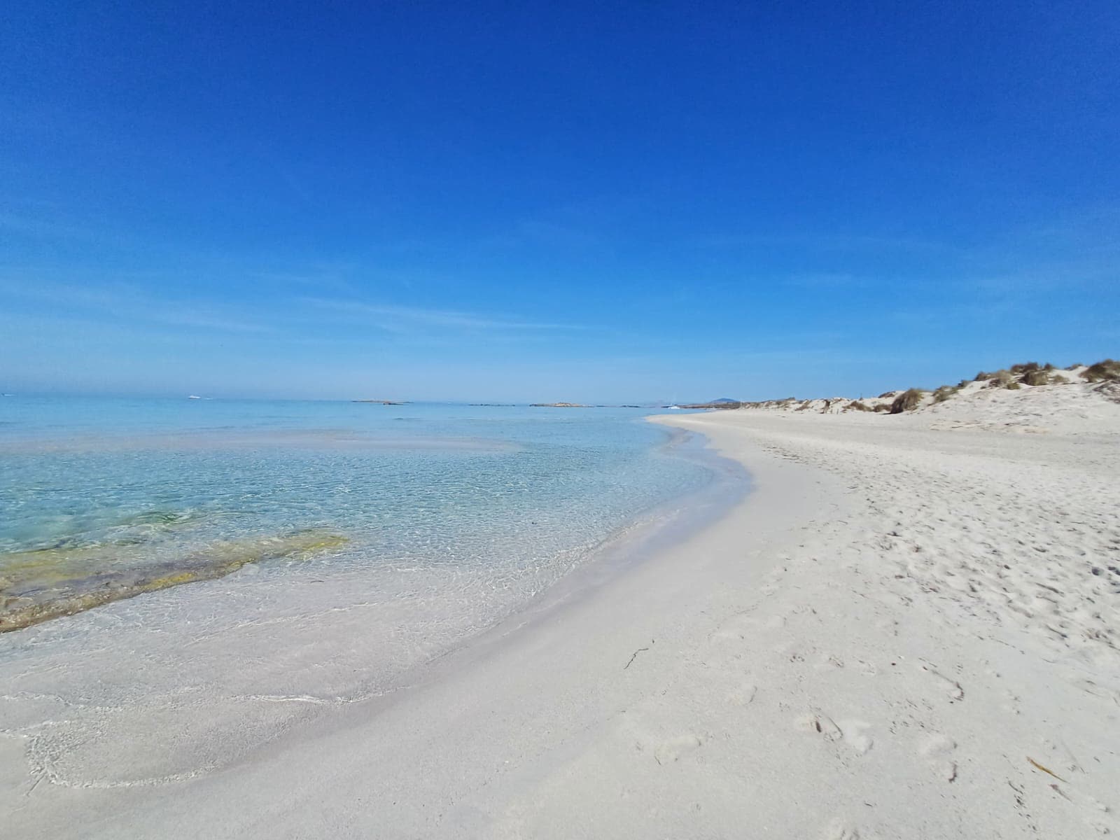 Espalmador white sand beach and turquoise shallows between Ibiza and Formentera