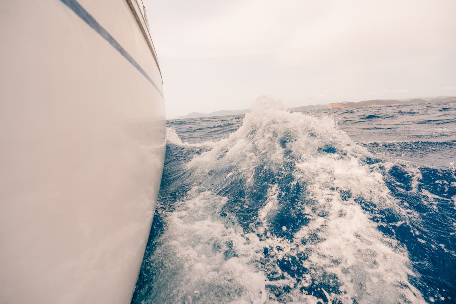 Sailboat moving through open water on an Ibiza day tour