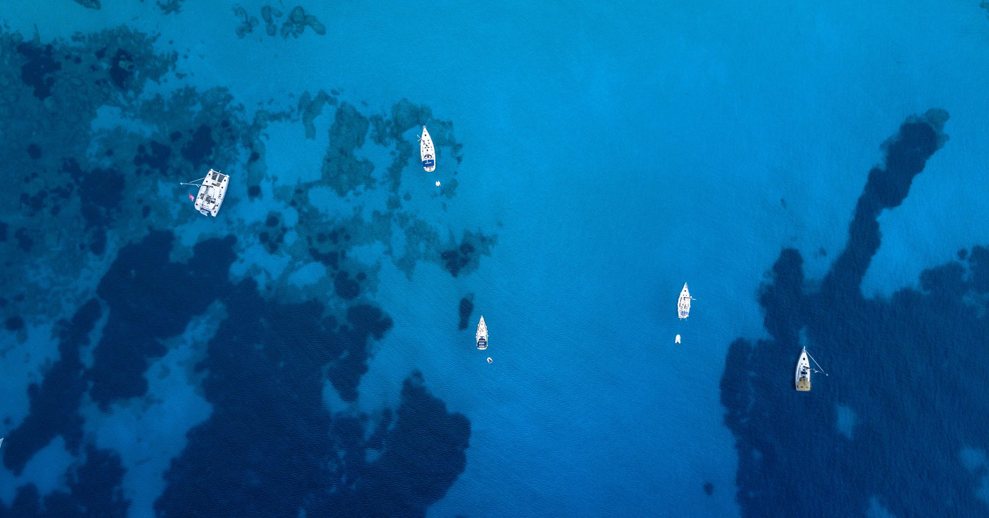 Aerial view of sailboats on a boat tour between Ibiza and Formentera